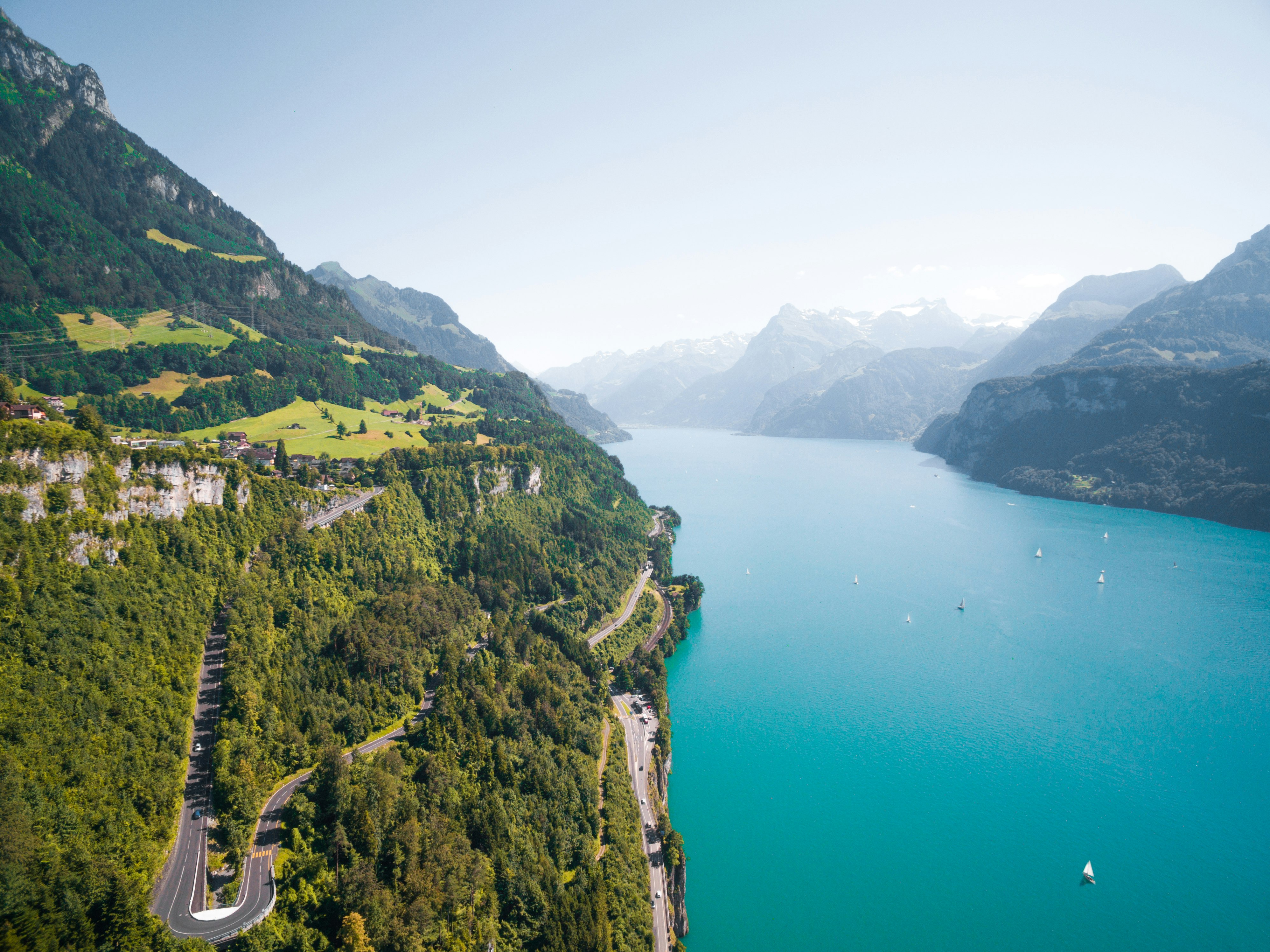 bird's eye photography of body of water near mountain